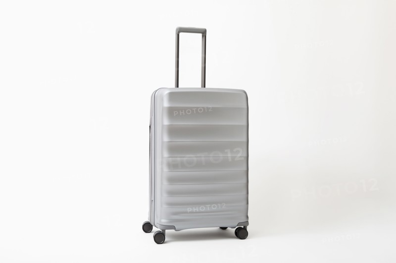 Studio shot of silver rolling suitcase, New York, NY, USA