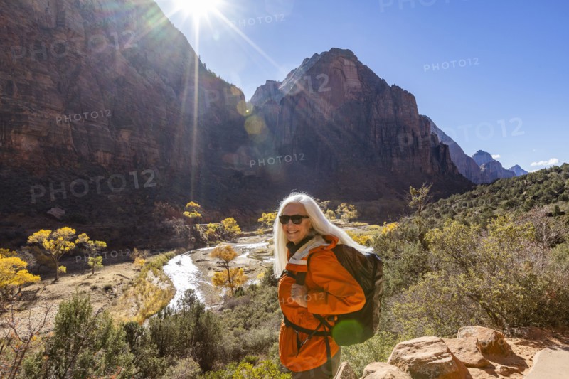 Portrait of woman hiking near Angels Landing Trail overlooking Virgin River, , Utah, USA