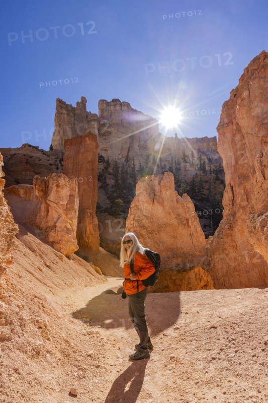 Portrait of smiling woman hiking in Bryce Canyon National Park on sunny day, , Utah, USA