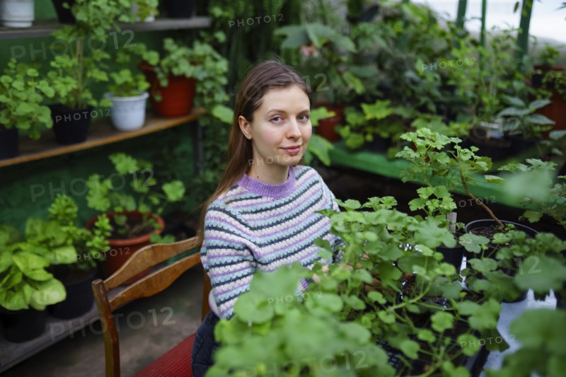 Portrait of woman standing in greenhouse, Omsk, , Russia
