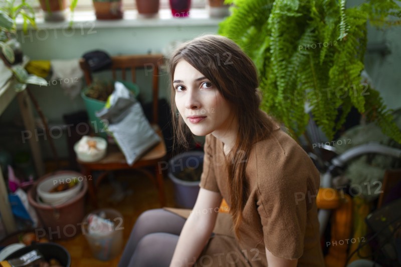 Portrait of pensive woman in living room, Omsk, , Russia