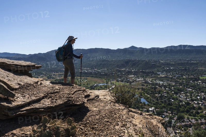 Usa, Colorado, Durango, Woman standing on ledge in San Juan Mountains, Durango, Colorado, USA