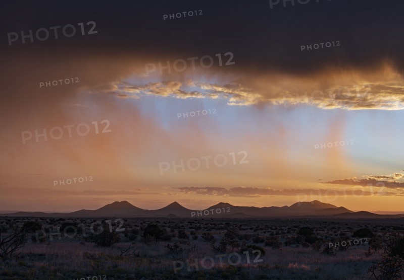 Usa, New Mexico, Santa Fe, Storm and rain over Cerrillos Hills at sunset, Santa Fe, New Mexico, USA