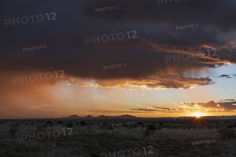 Usa, New Mexico, Santa Fe, Storm and rain over Cerrillos Hills at sunset, Santa Fe, New Mexico, USA