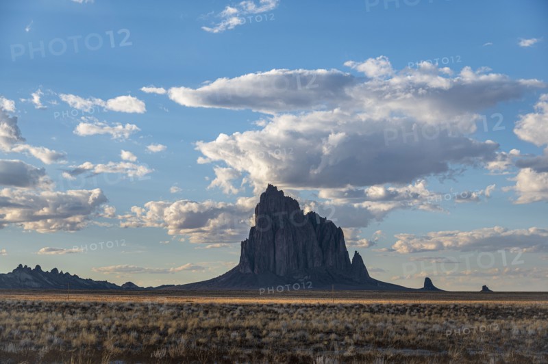 Usa, New Mexico, Shiprock, Clouds over desert landscape with Shiprock, Shiprock, New Mexico, USA