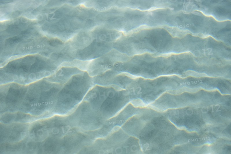 USA, United States Virgin Islands, St. John, Patterns in sand beneath light reflecting on water surface, St. John, United States Virgin Islands, USA