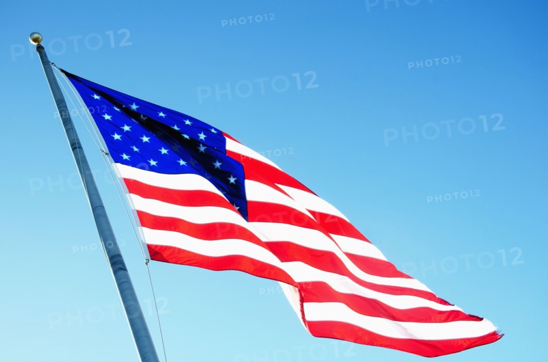 American flag blowing inn wind against clear sky, Hampstead, North Carolina, USA