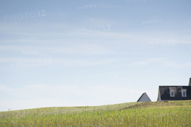 House roof visible beyond grassy hill, Nashville, Tennessee, USA, Nashville, Tennessee, USA