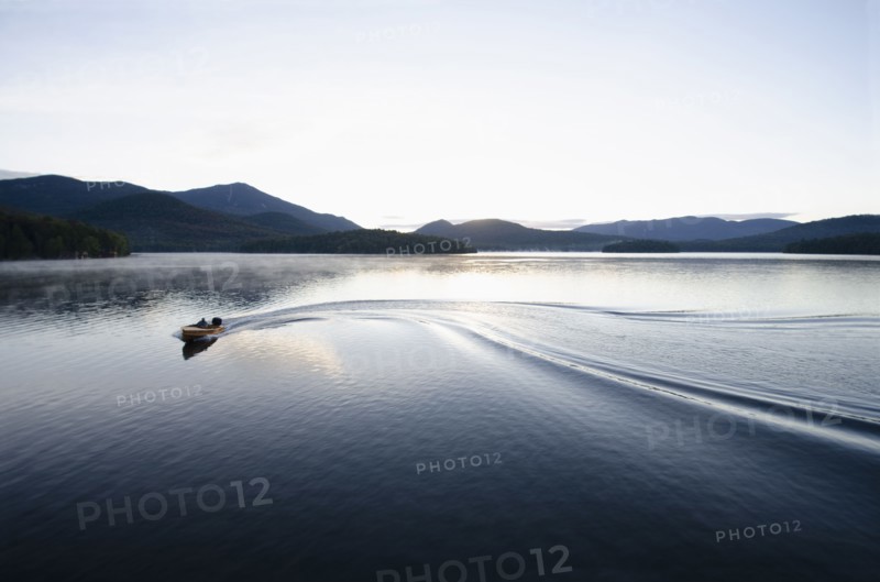Boating at dawn on Lake Placid Lake, North Elba, New York, USA, Lake Placid, New York, USA