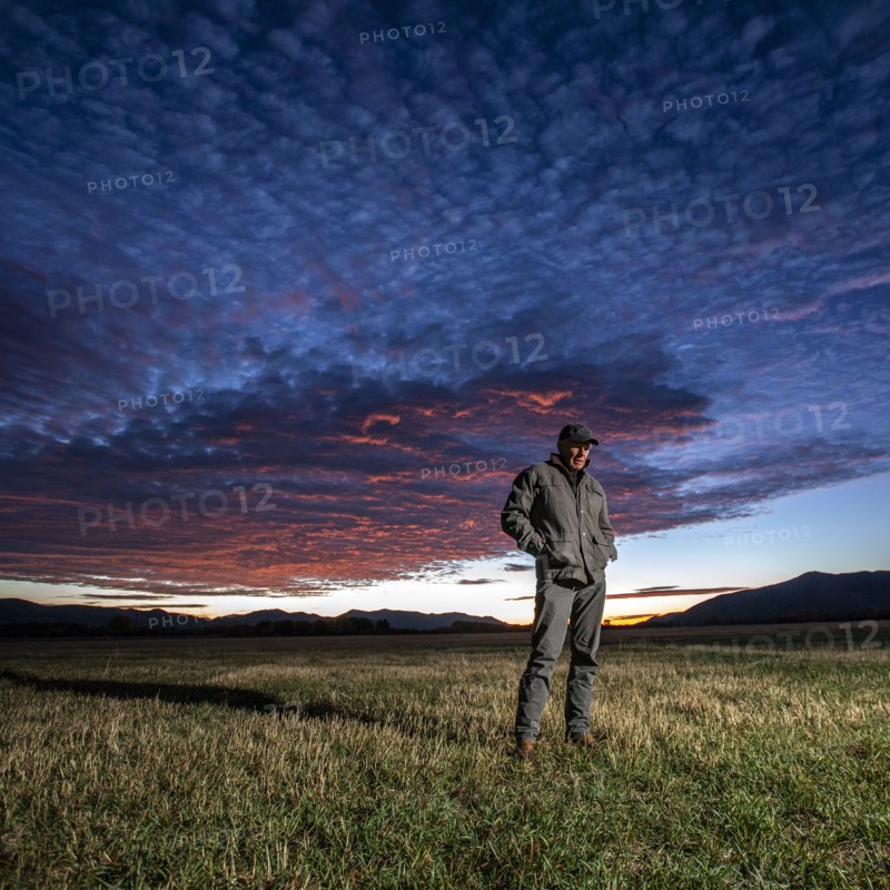 USA, Idaho, Bellevue, Farmer standing in field at sunrise, Bellevue, Idaho, USA