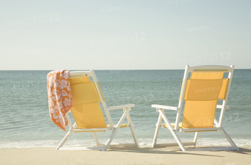 USA, Massachusetts, Nantucket, Two yellow beach chairs on sandy beach facing ocean, Nantucket, Massachusetts, USA