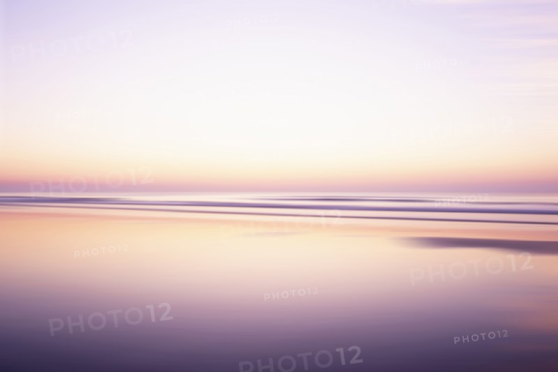 USA, New Jersey, Stone Harbor, Calm purple and orange water surface and sky at sunrise, Stone Harbor, New Jersey, USA