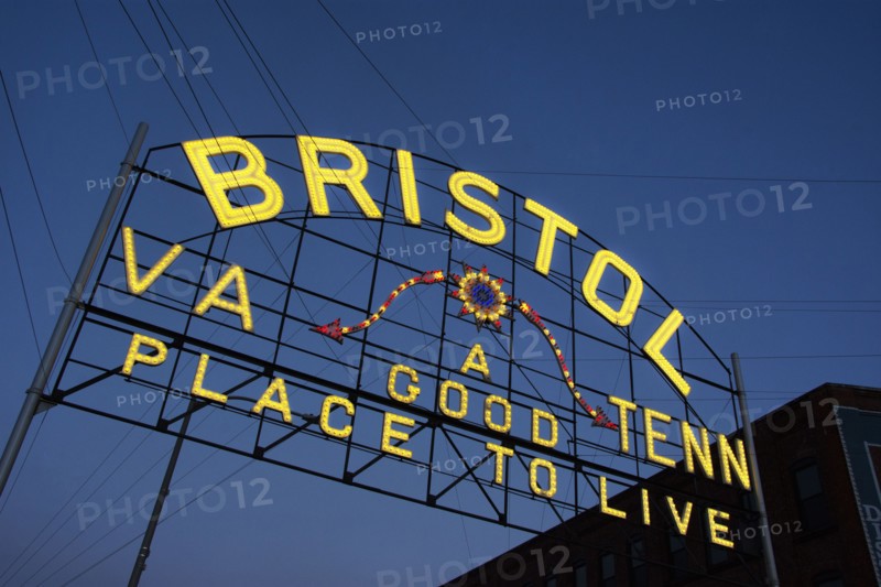 USA, Virginia, Bristol, Low angle view of Bristol sign over State Street against sky at dusk, Bristol, Virginia, USA