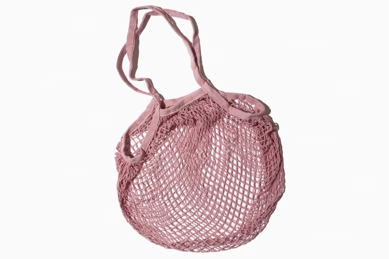 USA, New York State, New York City, Pink mesh tote bag on white background, New York City, New York, USA