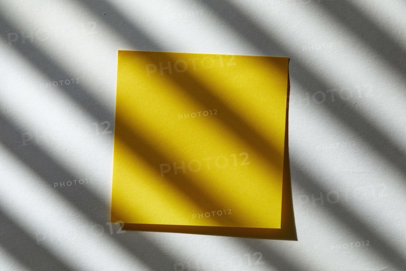 USA, New York State, New York City, Yellow blank post it note in sunlight, New York City, New York, USA