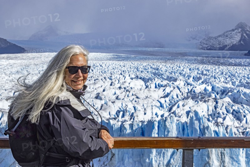 Argentina, Santa Cruz, El Calafate, Portrait of woman at Perito Moreno glacier ice formations, El Calafate, Santa Cruz, Argentina