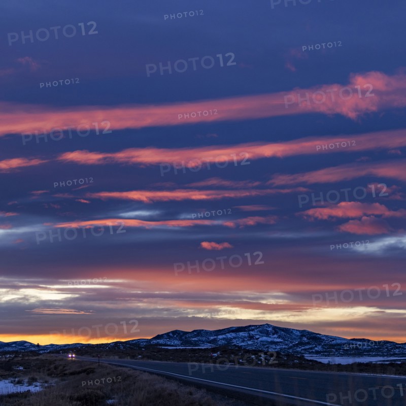 Pink sunset skies over ID-20 outside Mountain Home in snow, Mountain Home, Idaho, USA