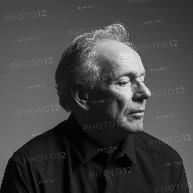 Studio portrait of serious senior man in black shirt, black and white, Bellevue, Idaho, USA