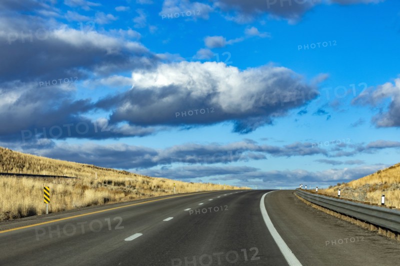 Cumulus clouds over Interstate 80, Elko, Nevada, USA