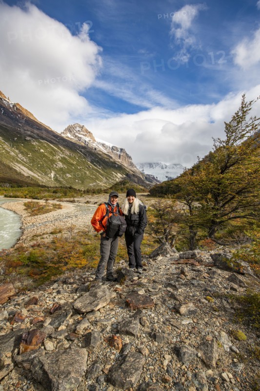 Argentina, Santa Cruz, El Chalten, Portrait of smiling hikers standing near Electrico River, El Chalten, Santa Cruz, Argentina