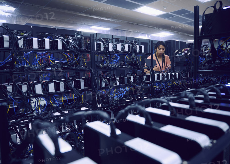 Female technician working in server room 
St, George, Utah, USA