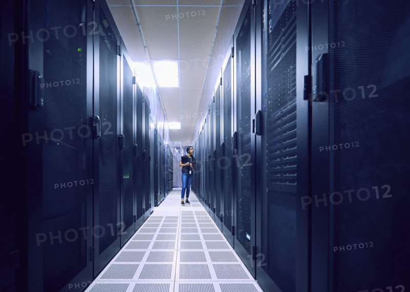 Female technician walking in server room
St, George, Utah, USA