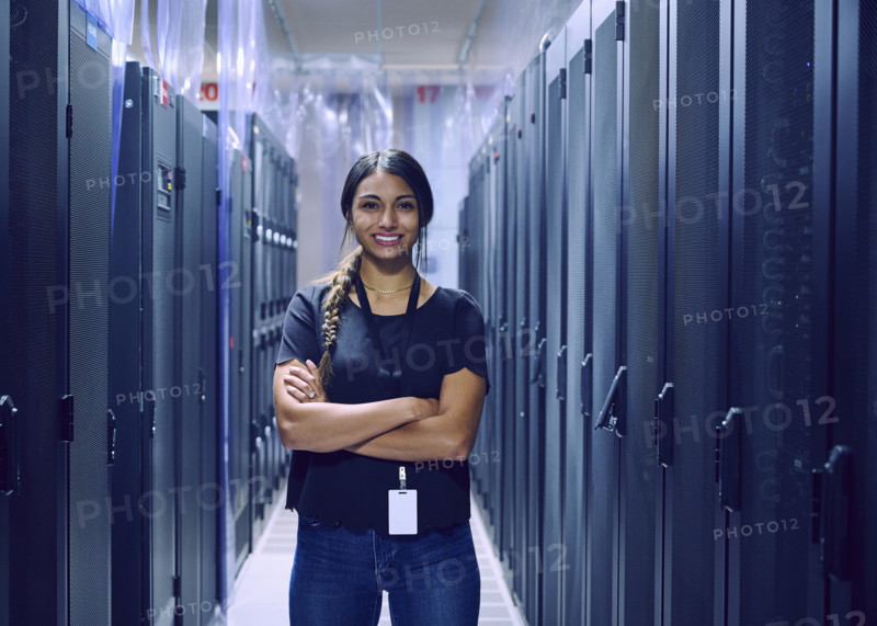 Portrait of smiling female technician in server room 
St, George, Utah, USA