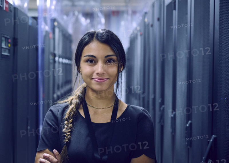Portrait of smiling female technician in server room 
St, George, Utah, USA
