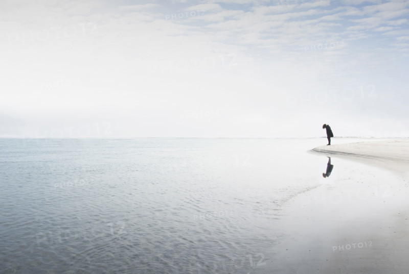 Silhouette of woman staring at edge of water
Hampstead, North Carolina, USA