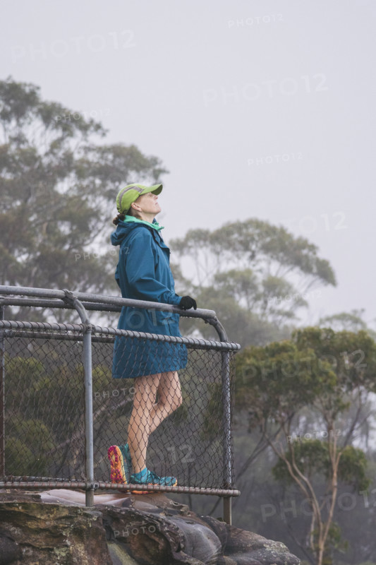 Female hiker in jacket and baseball cap standing on observation point
Katoomba, New South Wales, Australia