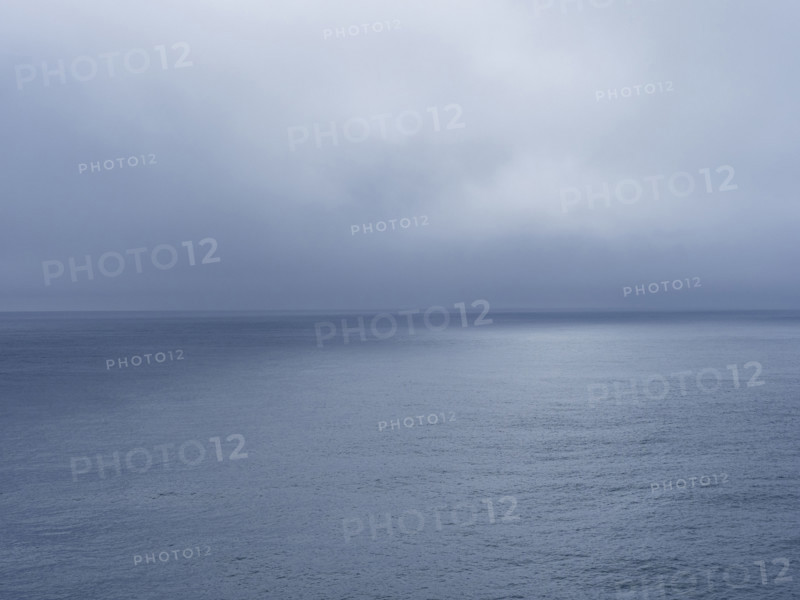 Storm clouds over calm sea
USA