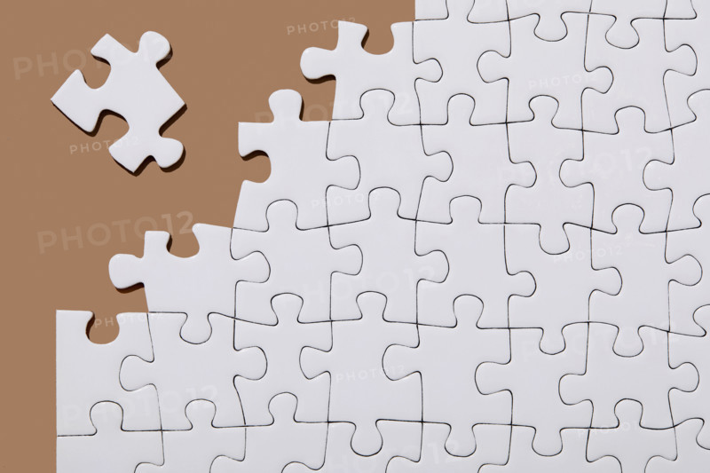 Studio shot of white jigsaw puzzle pieces
USA