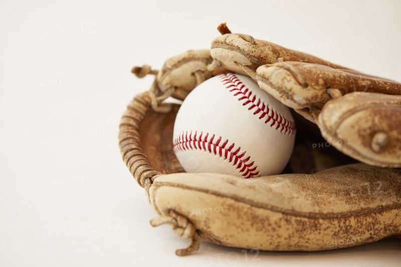 Studio shot of baseball mitt with hard ball
New York City, NY USA