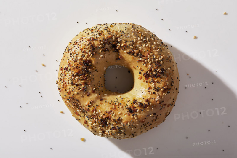 Overhead view of seeded bagel on white background
New York City, NY USA