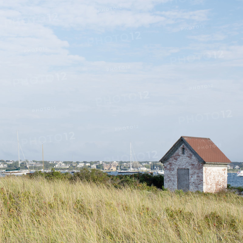 Small stone building and harbor with sailboats
Nantucket, Massachusetts, USA