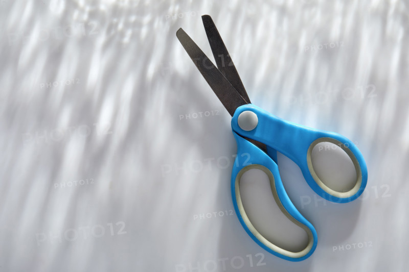 Blue children's scissors on white background
New York City, New York State, USA