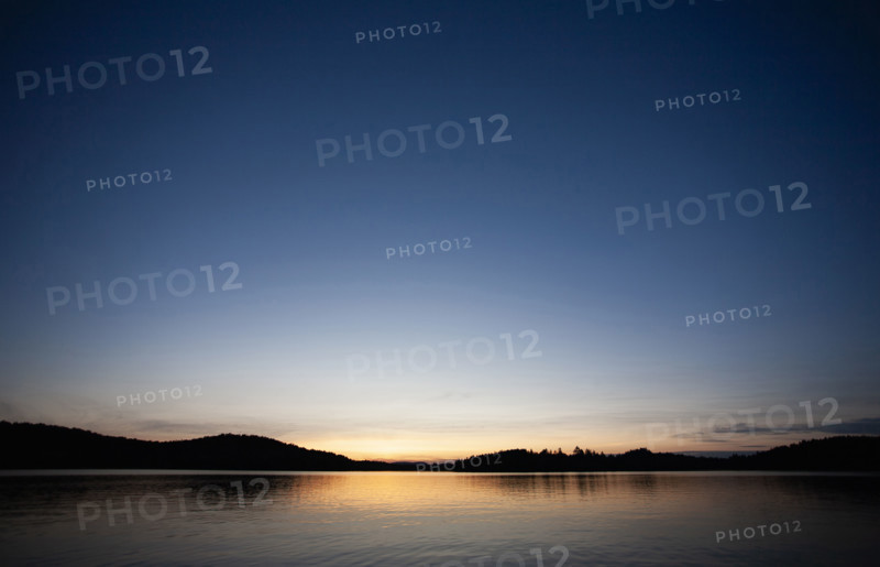 Sunset at calm Upper Saranac Lake
Santa Clara, New York, USA