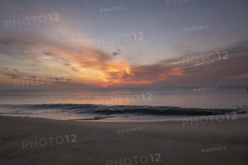Sunrise over calm sea and sandy beach
Nags Head, North Carolina, USA