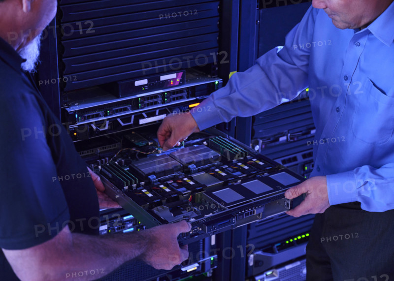 Two men working in data center
