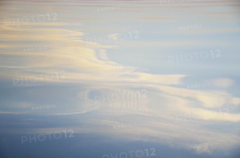 Evening sky reflected on lake surface