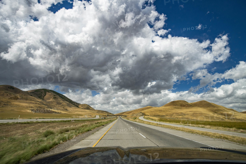 USA, Utah, Snowville, Empty road and clouds seen from car
