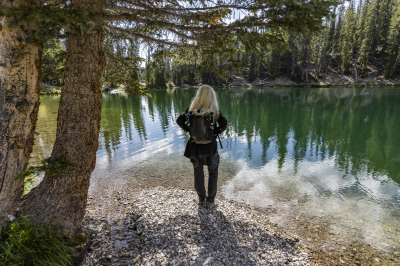 USA, Idaho, Sun Valley, Rear view of woman facing calm Norton Lake