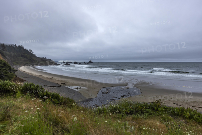 USA, Oregon, Cannon Beach, Gray clouds over empty beach