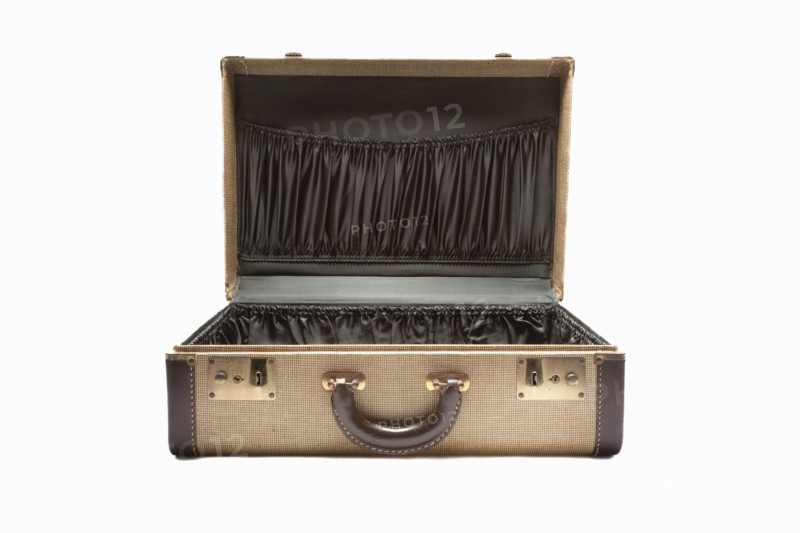 Open antique suitcase on white background