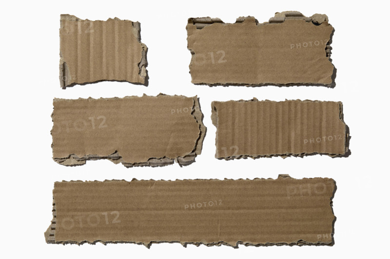 Pieces of torn cardboard on white background