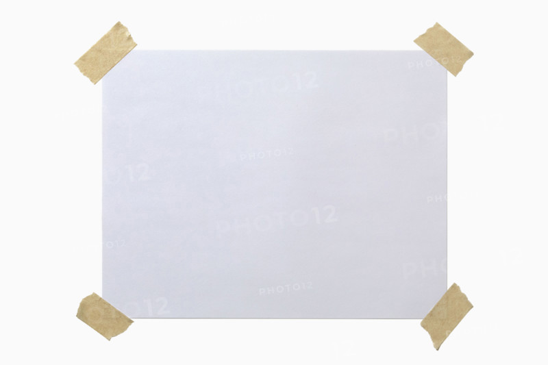Blank paper taped to white background