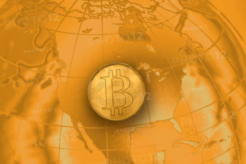 Bitcoin floating over world map
