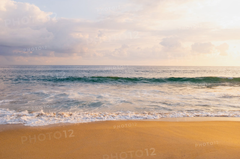 Mexico, Oaxaca State, Puerto Escondido, Costa Chica, Clouds over ocean waves on empty beach