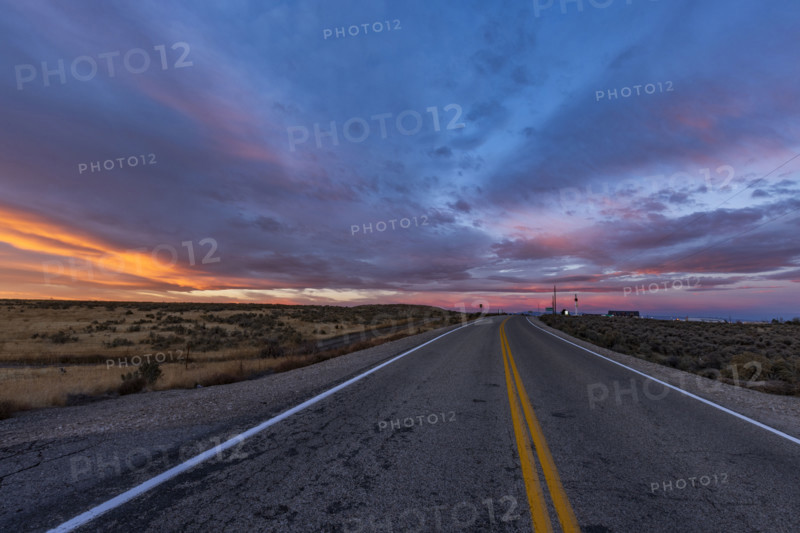 USA, Idaho, Boise, Dramatic sunrise sky above empty Interstate 84