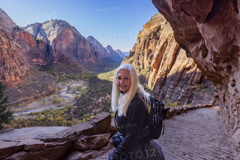 USA, Utah, Zion National Park, Portrait of senior woman on trail to Angels Landing